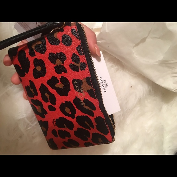 Brand new COACH animal print wristlets