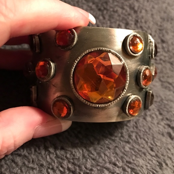 A cuff bracelet hammered silver with orange gems