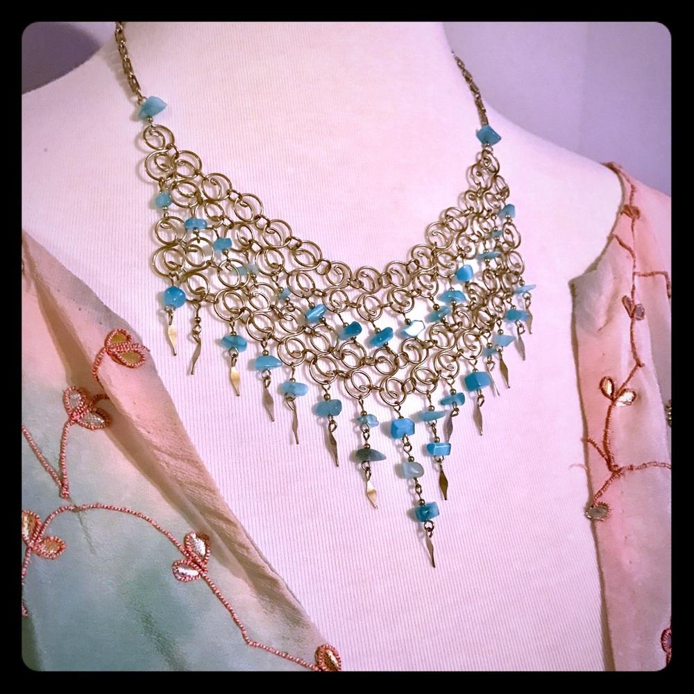 Silver bib necklace with aqua gems