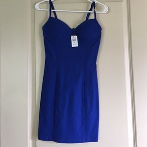 A small sized tight fitted blue dress.