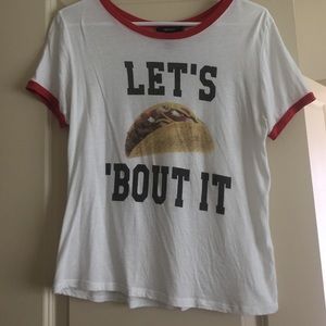 A medium sized white, funny taco shirt.