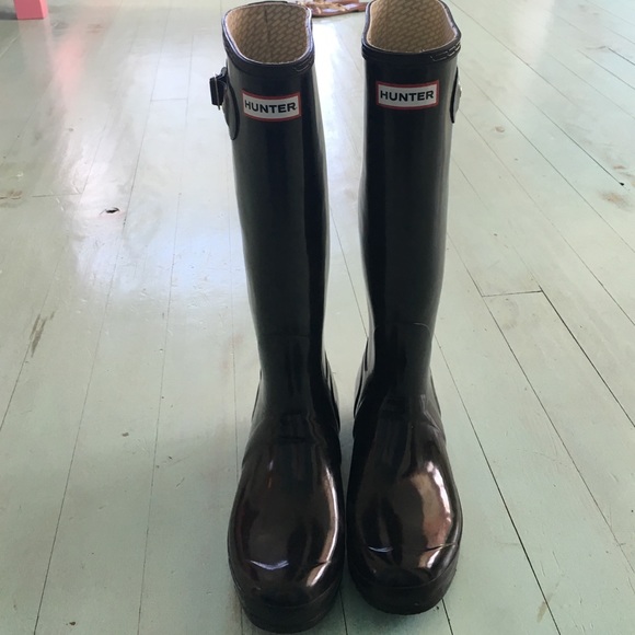 Black glossy hunter rain boots.