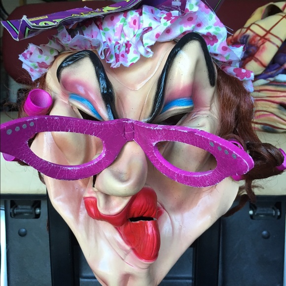 House lady in rollers rubber face mask