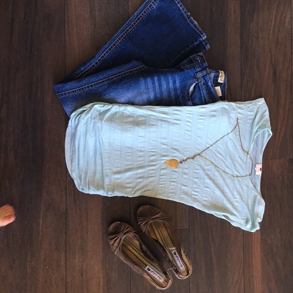 Teal striped shirt. Gathered sides.