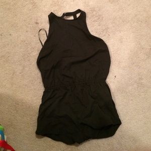 A black high neck romper