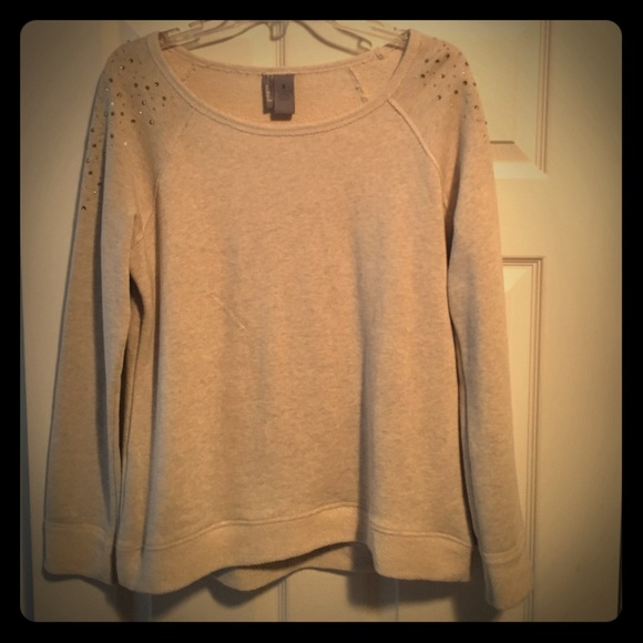 Tan sweater with rhinestones.