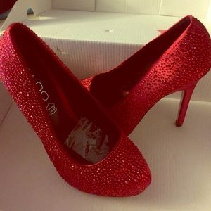 Red with red diamond heels . Worn once
