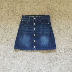 A button up denim skirt with built in shorts