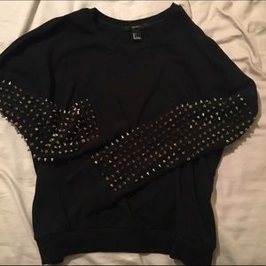 black sweater gold spikes