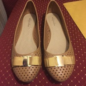 Tan flats with gold bow detail