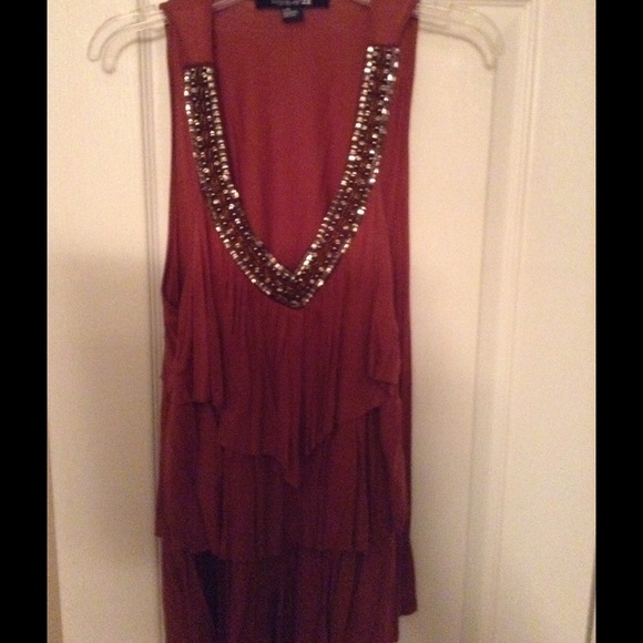 Sleeveless blouse with ruffles