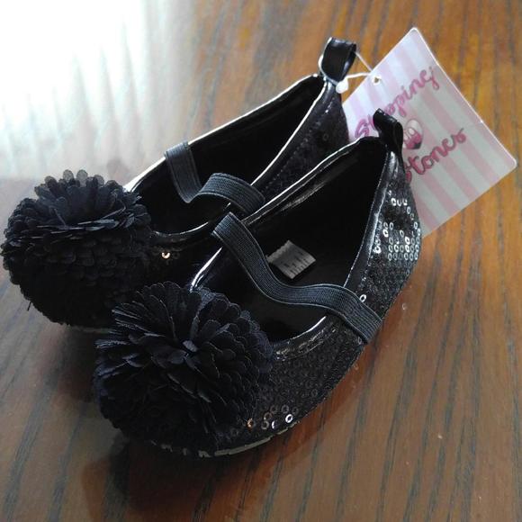 Black pom pom shoes