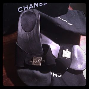 Chanel wood and suede slides.