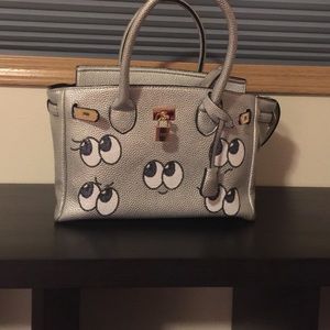 Super cute metallic Birkin style bag.