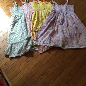4 elastic top sundresses. Sizes 12-14 cute patterns