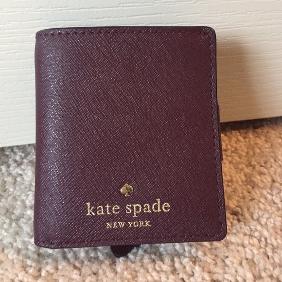 Petite wallet, cash, coins and cards.