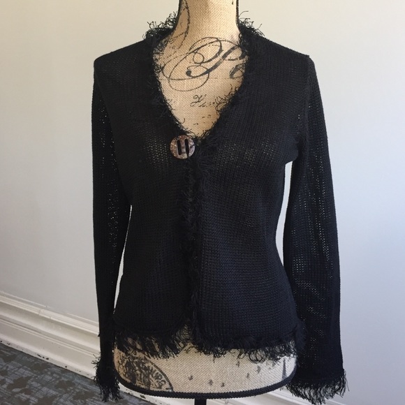 Sweater with single button closure and fringe