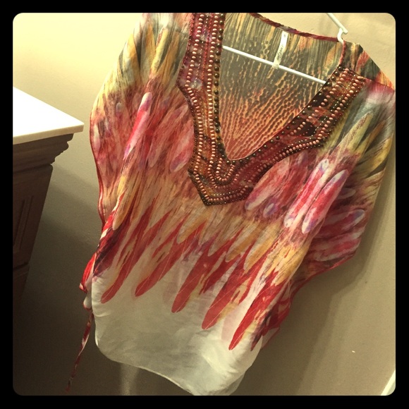 Fall colored, boutique-style, feather-print tunic