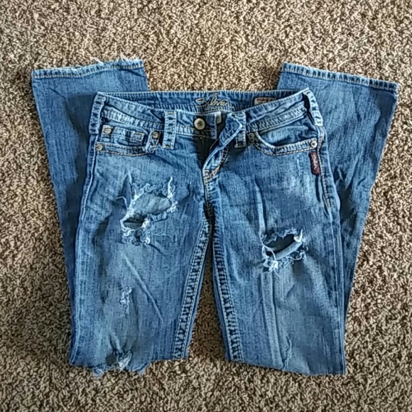 Distressed silver jeans