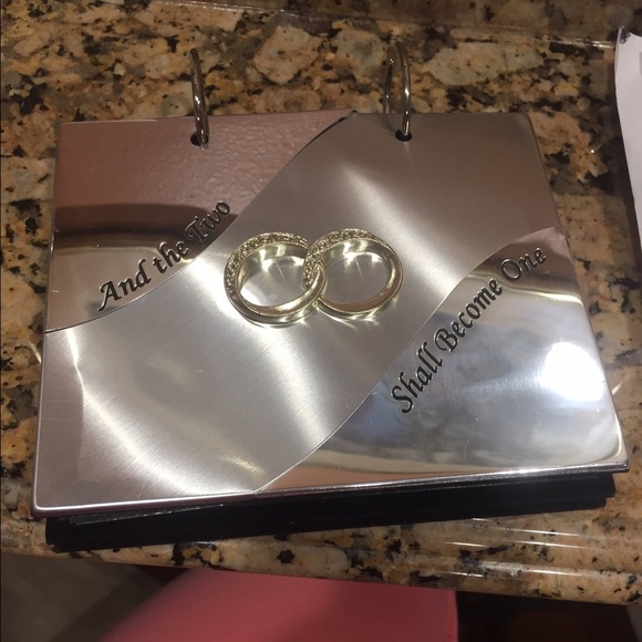 Wedding photo album with rings on front