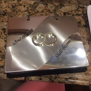 Wedding photo album with rings on front