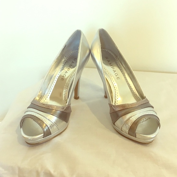 Like new 4 1/2 inch silver heels made by Rampage