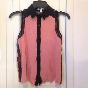 Pink sleeveless blouse with black lace detail