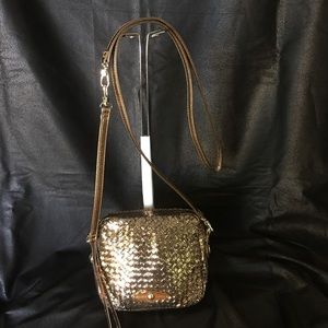 Elliott Luca metallic leather handbag.