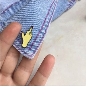 Middle finger enamel pin