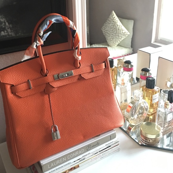 Selling the beautiful orange handbag