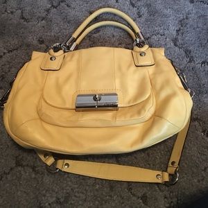 Tanish yellow coach purse