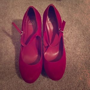 Red suede pumps