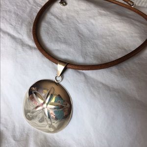 Leather necklace with sand dollar pendant