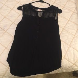 Black top with sheer shoulder detail.