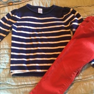 Navy and white sweater and red jeans