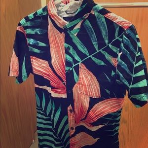 A floral button up short sleeve shirt