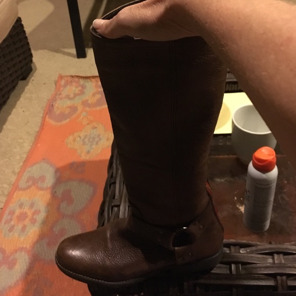 Brown leather with cute red zip back tall boots.
