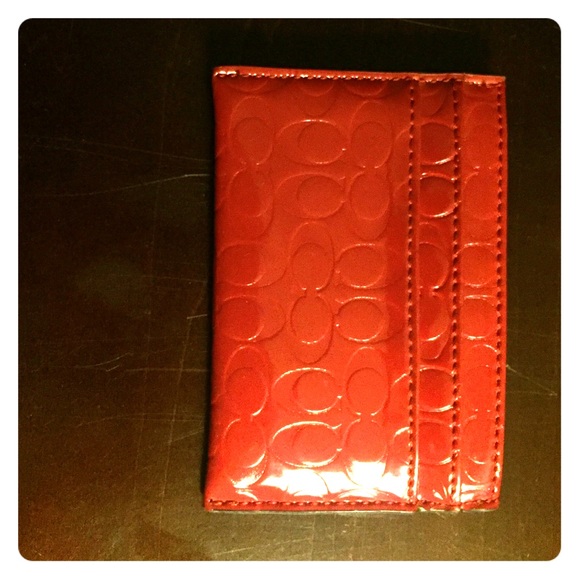 Small red patent leather card wallet from Coach