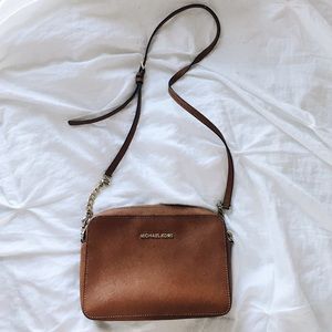 Micheal Kors cross body brown leather purse