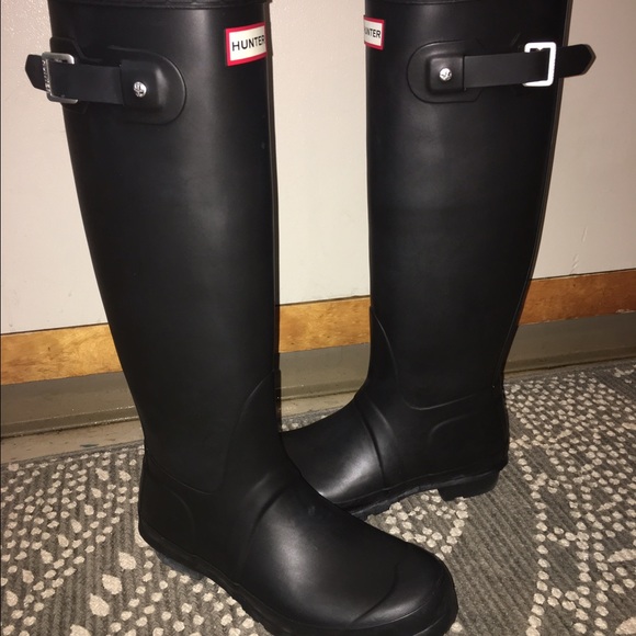 Tall black hunter boots