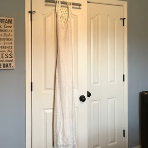 Elegant, strappy backed floor length cream lace