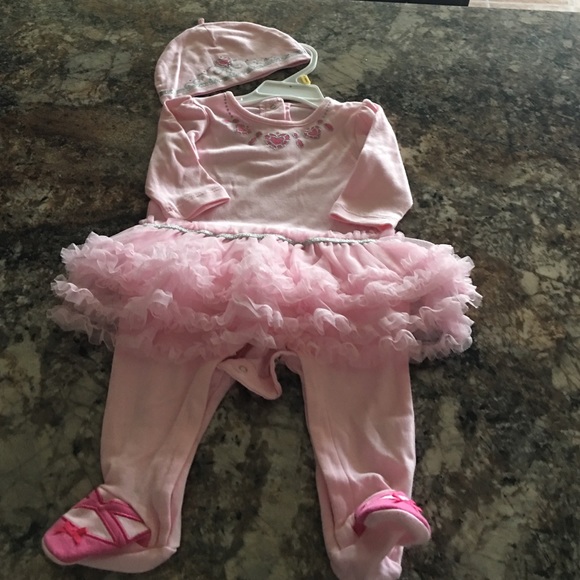 One piece with attached tutu and hat