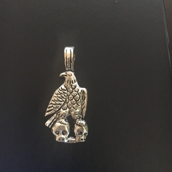 Eagle carrying skulls pendant silver look pendant