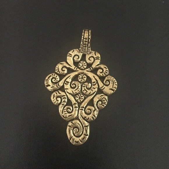 Tribal jewelry gold look metal carved pendant
