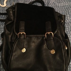 faux leather with gold hardware and faux fur