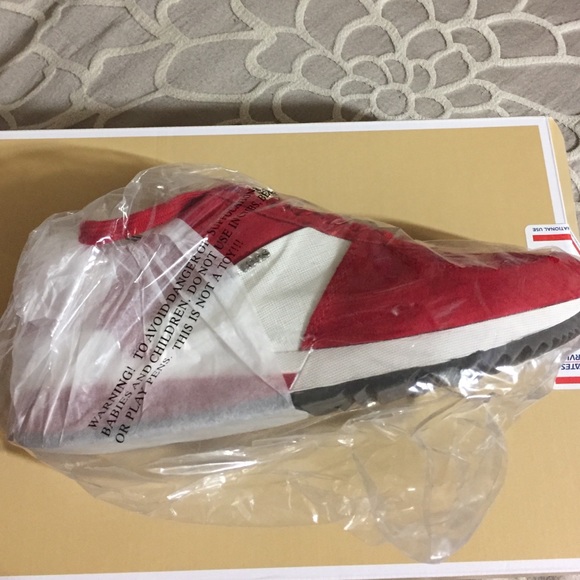 Red and White Michael Kors sneakers.