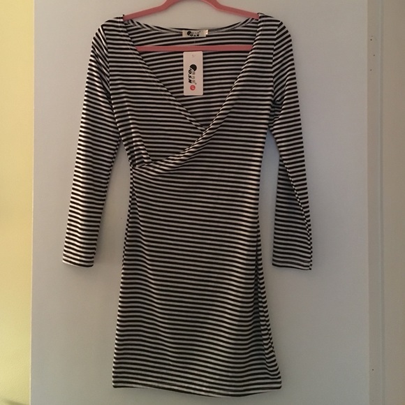 Faux wrap style fitted dress.