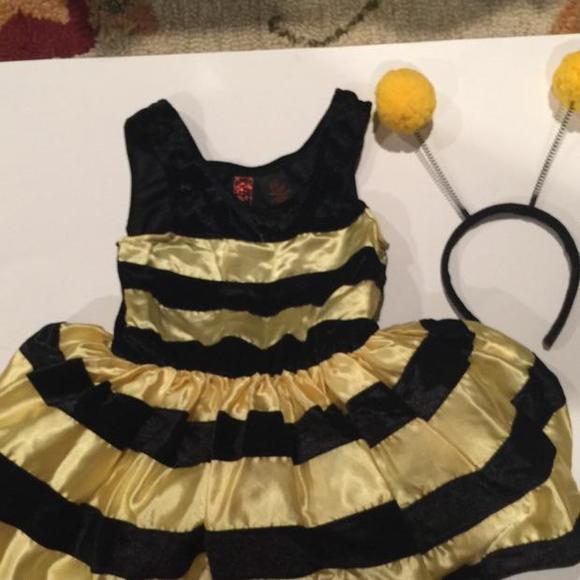 Adorable little girls bee costume with built in tutu. With head band .