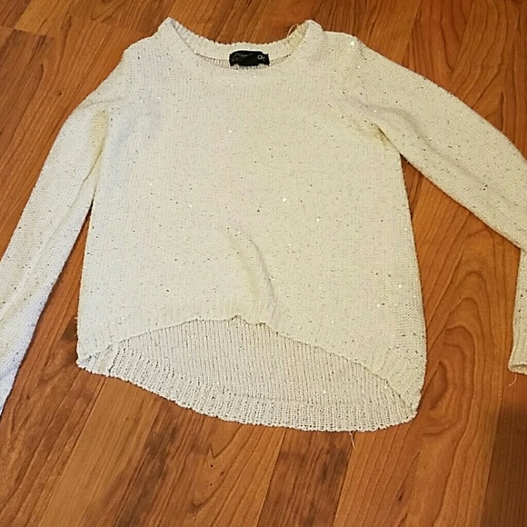 A sparkly long sleeve sweater