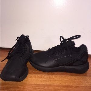 All black Adidas Tubulars